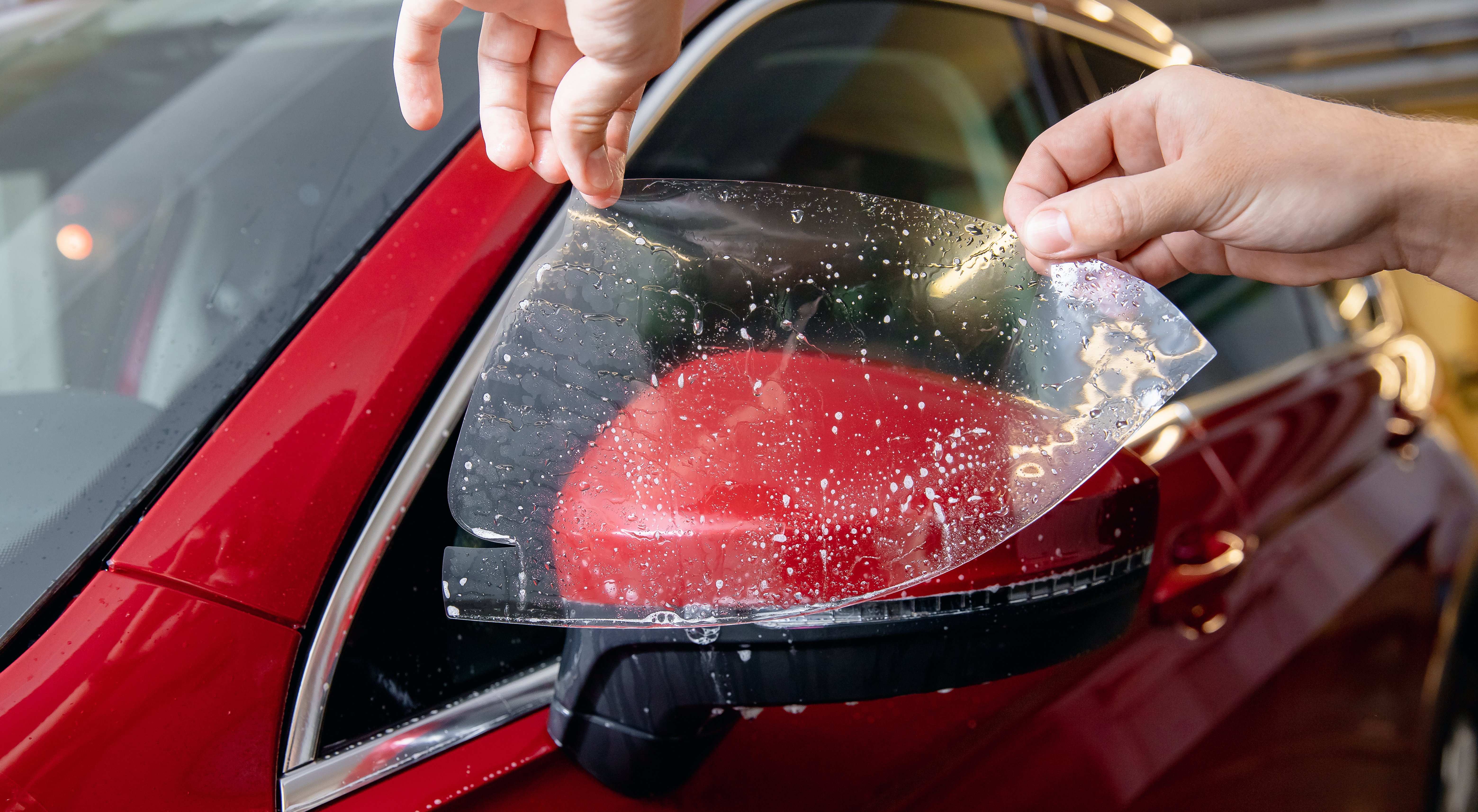 Premium Paint Protection Film (PPF) safeguards your vehicle's paint from road hazards